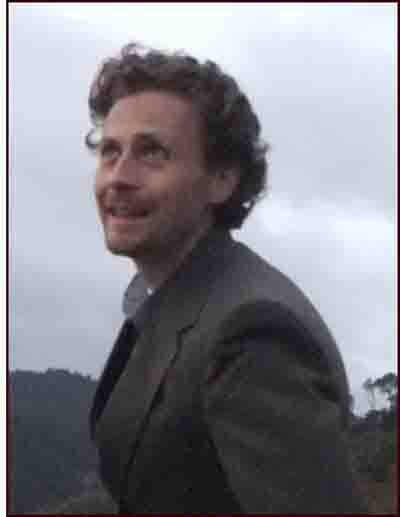 Picture of Stephan outside, looking up and smiling